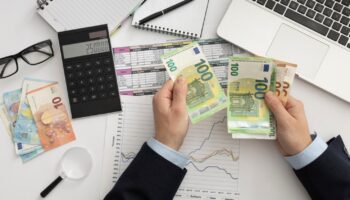 flat-lay-business-man-checking-finance-manners-min