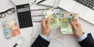flat-lay-business-man-checking-finance-manners-min